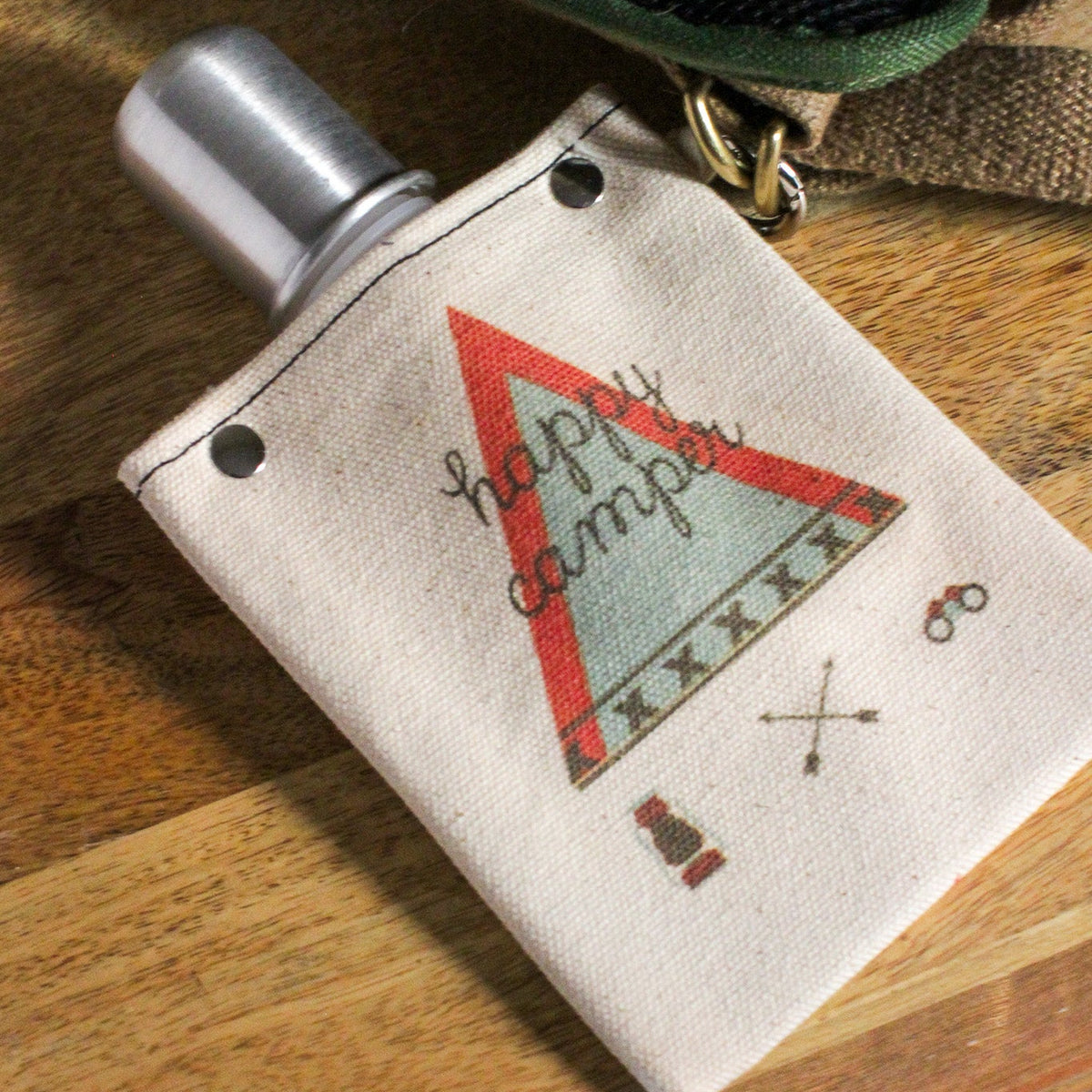 Happy Camper 120ml canvas flask with camping design, featuring a silver bottle and a rugged cotton cover.
