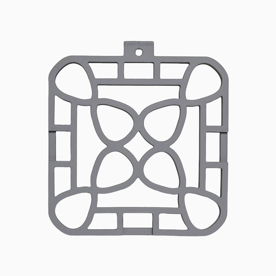 Interlocking silicone trivet in gray color with a unique modular design, providing stylish heat resistance for your table.