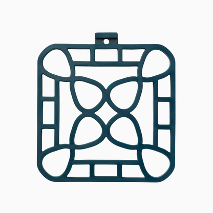 interlocking silicone trivet in blue with a unique design for heat-resistant protection and serving.