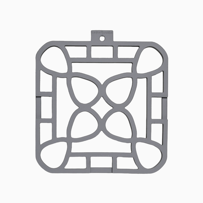 Interlocking silicone trivet in gray color with a unique modular design, providing stylish heat resistance for your table.
