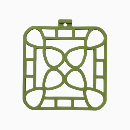 Interlocking silicone trivet in green color featuring a unique modular design for heat resistance and style.
