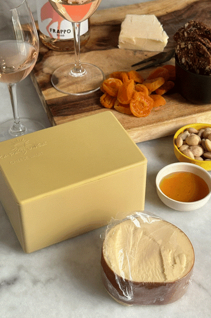 CapaBunga Cheese Vault with cheese and accompaniments on a marble table, perfect for cheese storage and freshness.