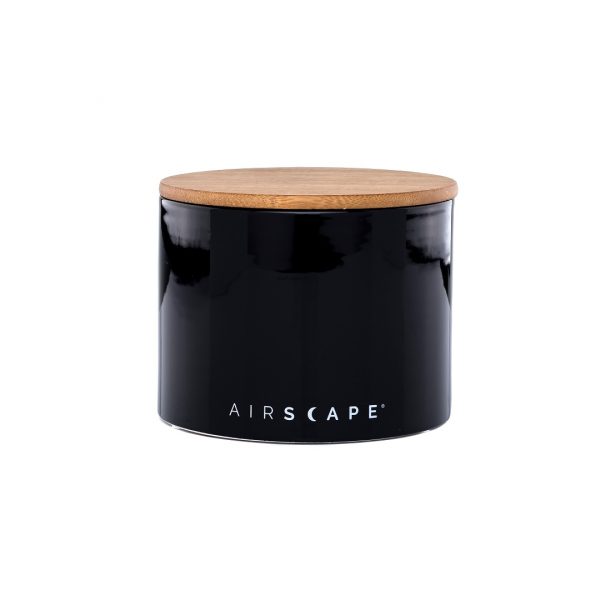 Photo of a black ceramic coffee storage bin with wooden lid.