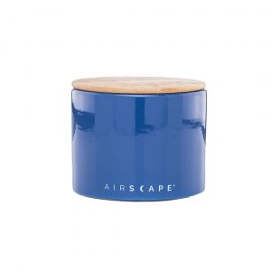 Photo of a blue ceramic coffee storage container with wooden lid.