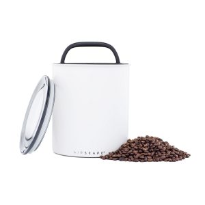 Photo of matte white Airscape kilo (large) coffee canister with pile of coffee beans to the right