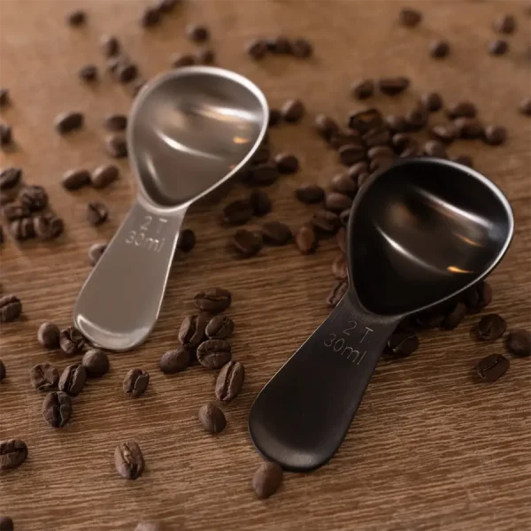 black and stainless steel coffee scoop