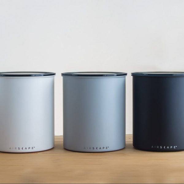 Airscape Kilos (galvanized steel coffee containers) in Ash (Matte Gray), Chalk (Matte White), and Charcoal (Matte Black). 6.5 inch width, 8 inch height