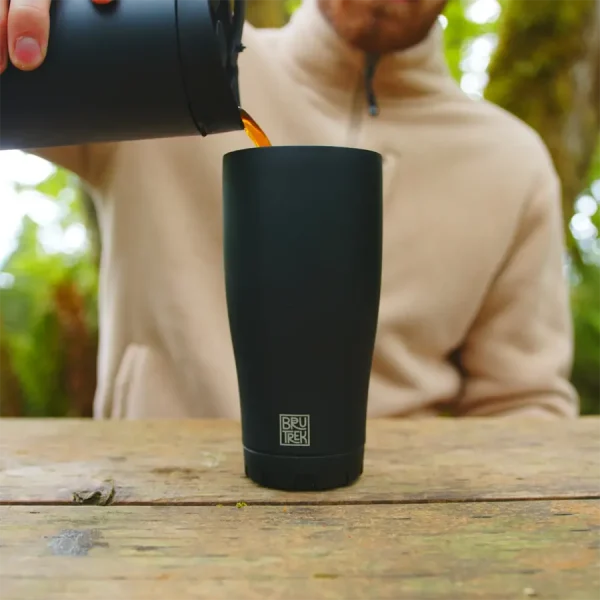 pouring coffee into a tumbler