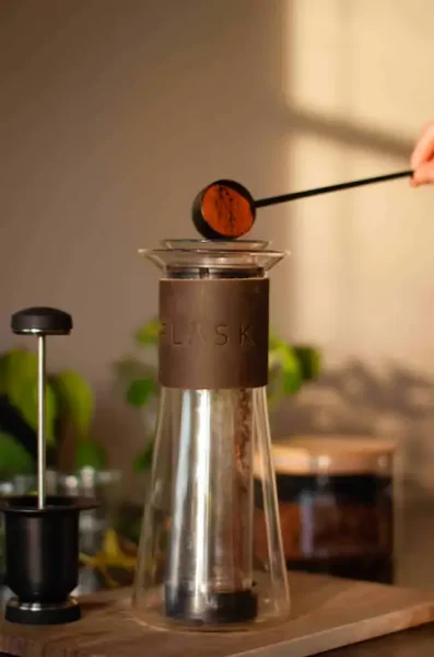 Flask Glass French Press Pouring coffee beans in